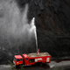Water is sprayed over coal to be used to generate electricity at a coal-fired power plant of Essar Power in Salaya village